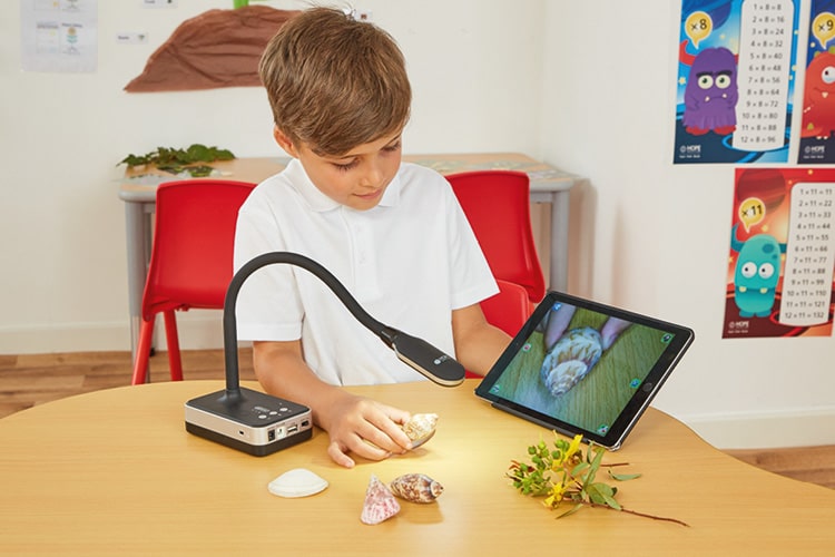 Child using a visualiser in the classroom